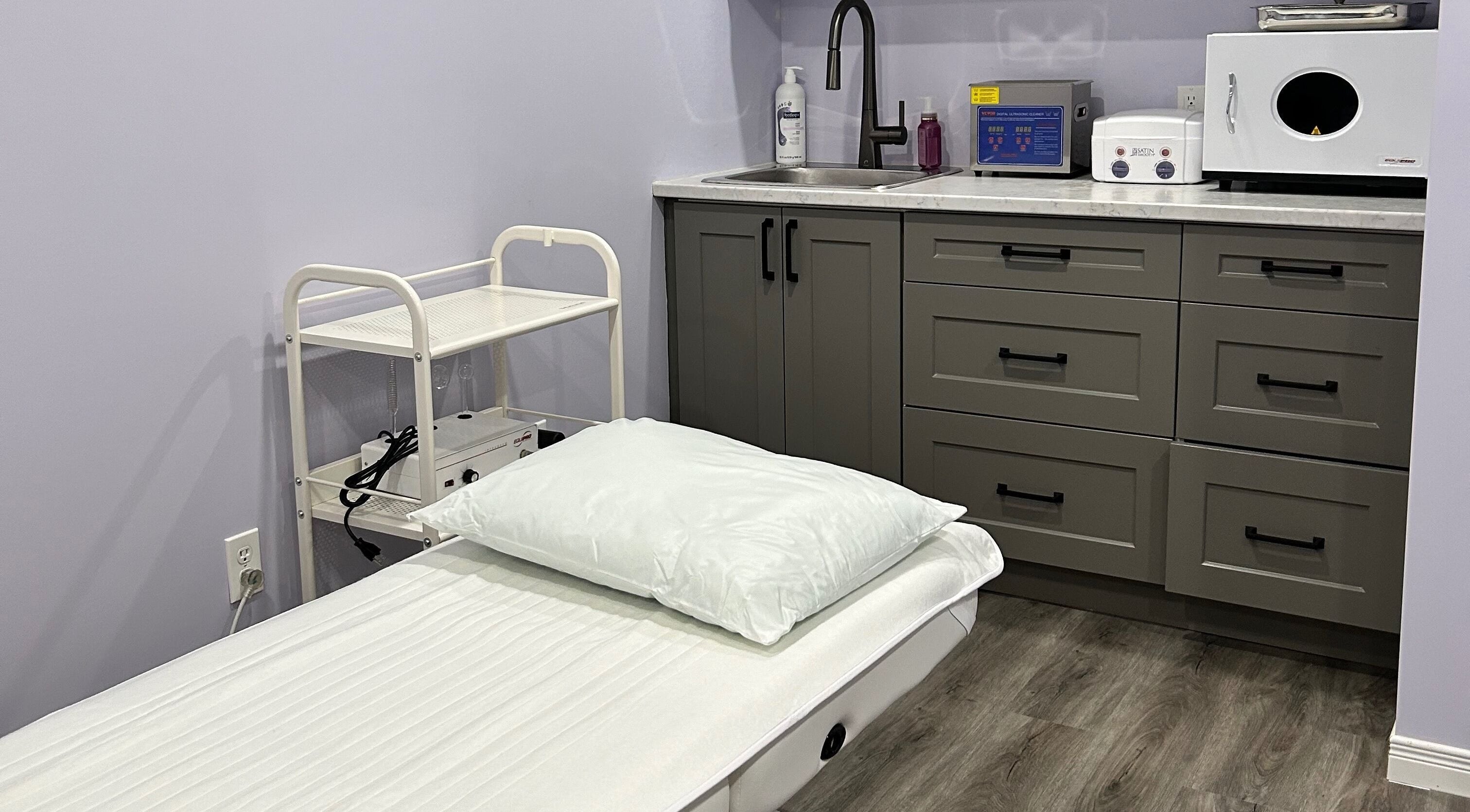 Serene treatment room at Refined Beauty, Meaford, Ontario, CA. Modern, inviting, perfect for relaxation.