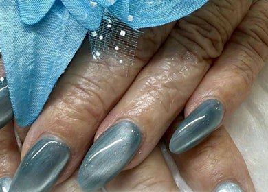 Stylish blue manicure at Diamond Nails (Perth CBD), Perth, Western Australia, AU with decorative flower.