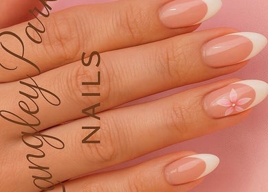 Stylish French manicure with floral design at Langley Park Nails, East Perth, Western Australia, AU.