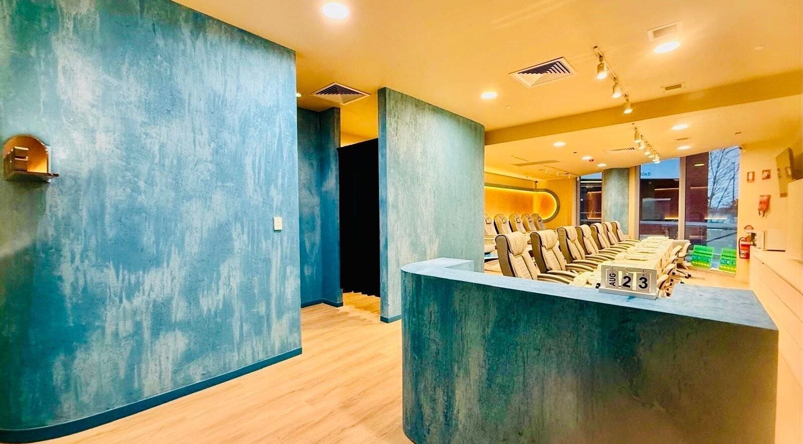 Modern interior of Langley Park Nails (East Perth), highlighted by elegant blue walls in East Perth, Western Australia, AU.
