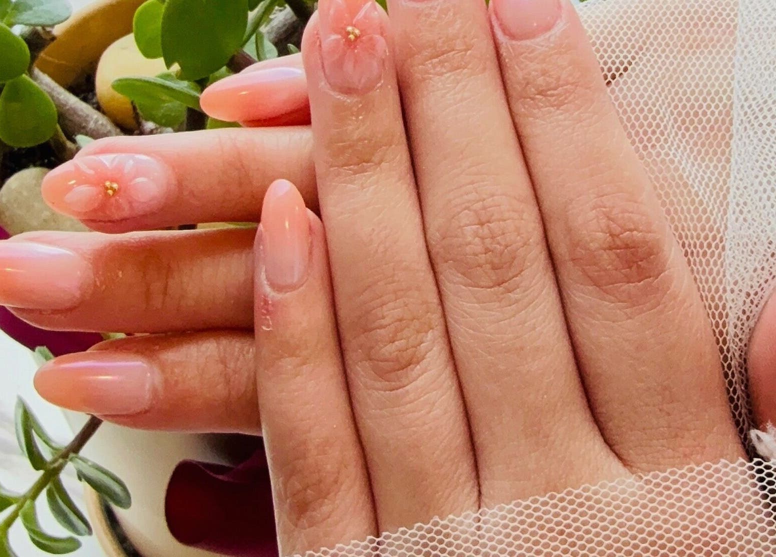 Elegant pastel manicure at Langley Park Nails (East Perth), East Perth, Western Australia, AU with a touch of floral art.