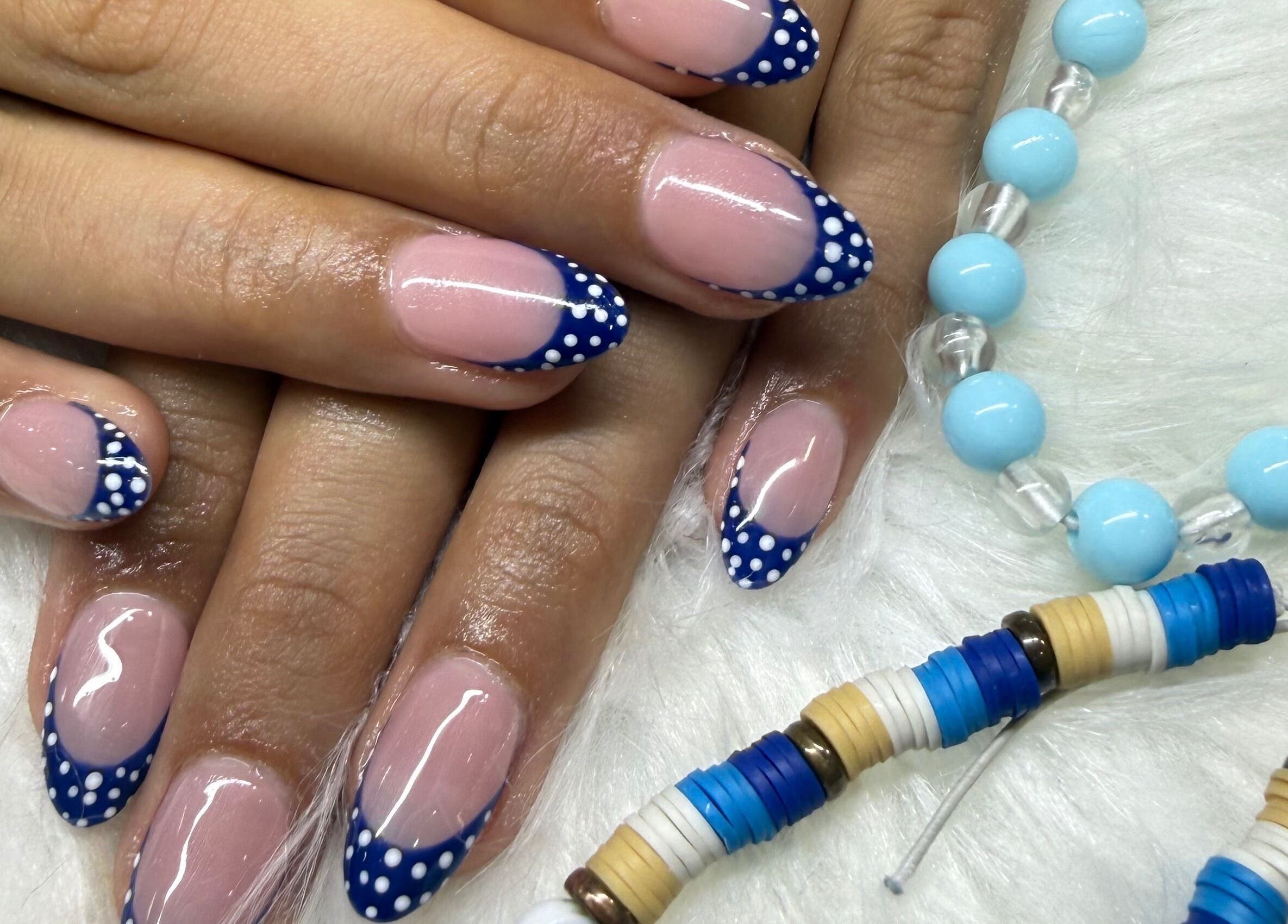 Stylish polka dot nail art at Langley Park Nails (East Perth), East Perth, Western Australia, AU with blue accessories.