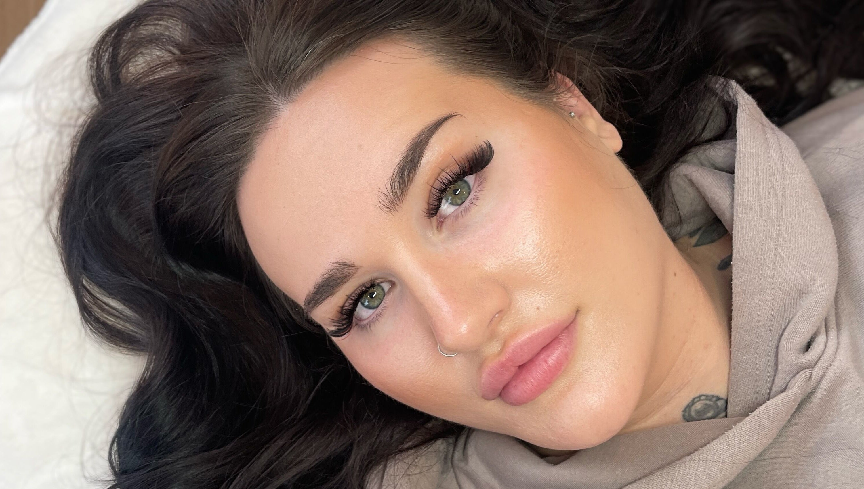 Close-up of a model showcasing bold lashes at Lisa's Lashes in Waun Fawr, Wales, GB.