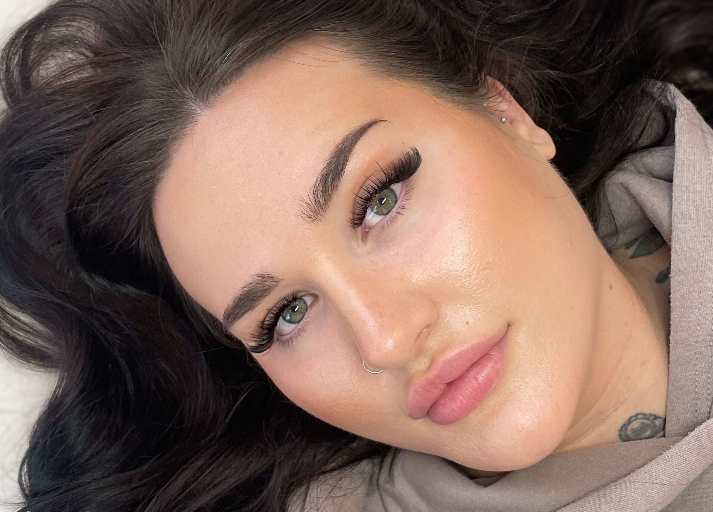 Close-up of a model showcasing bold lashes at Lisa's Lashes in Waun Fawr, Wales, GB.