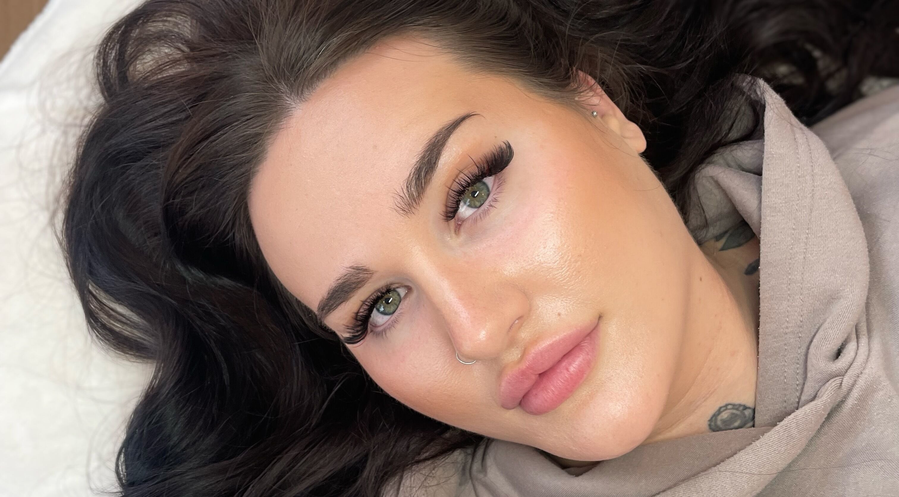 Close-up of a model showcasing bold lashes at Lisa's Lashes in Waun Fawr, Wales, GB.