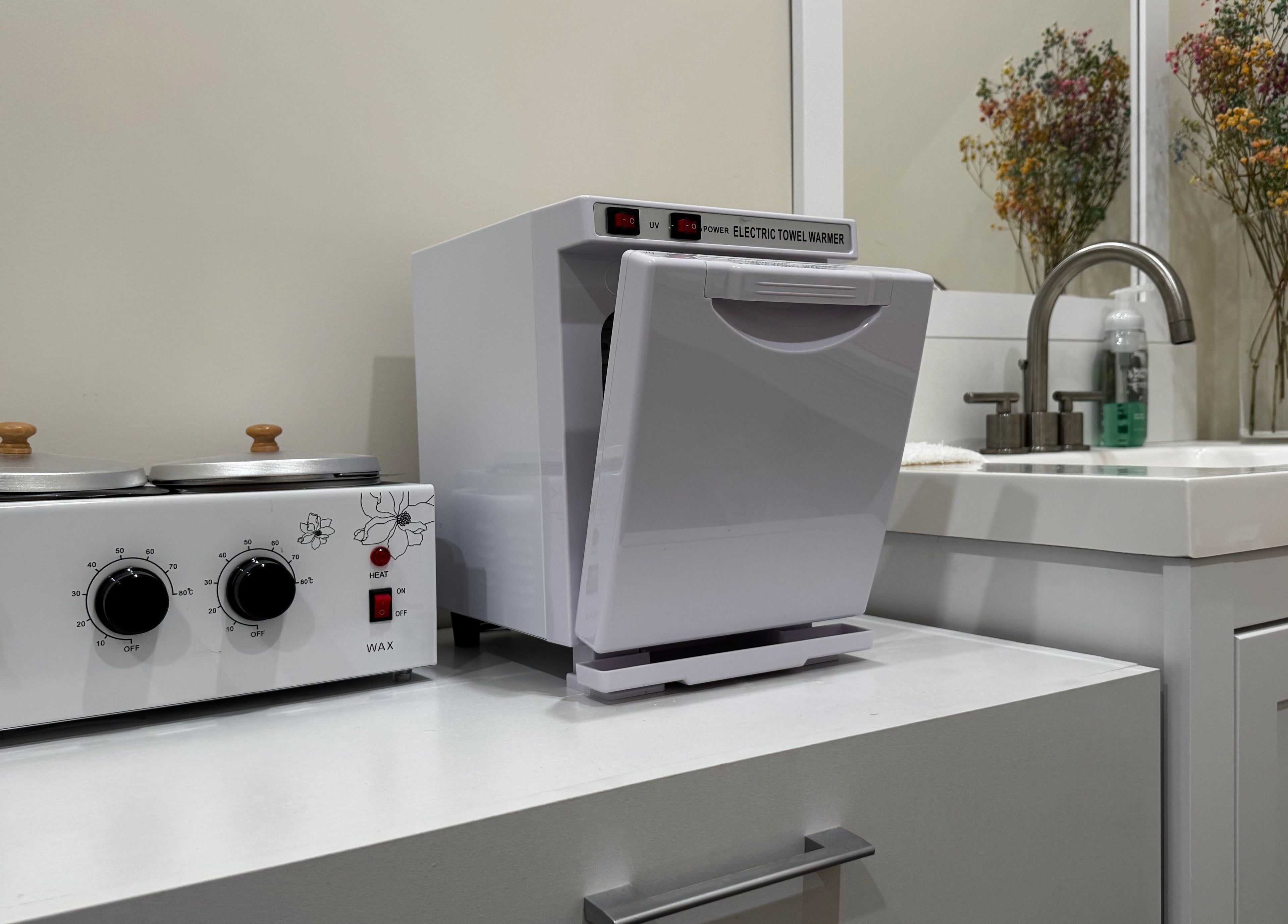 Wax heater and towel warmer at Sugaring & Waxing by Ervina, Los Angeles, California, US.