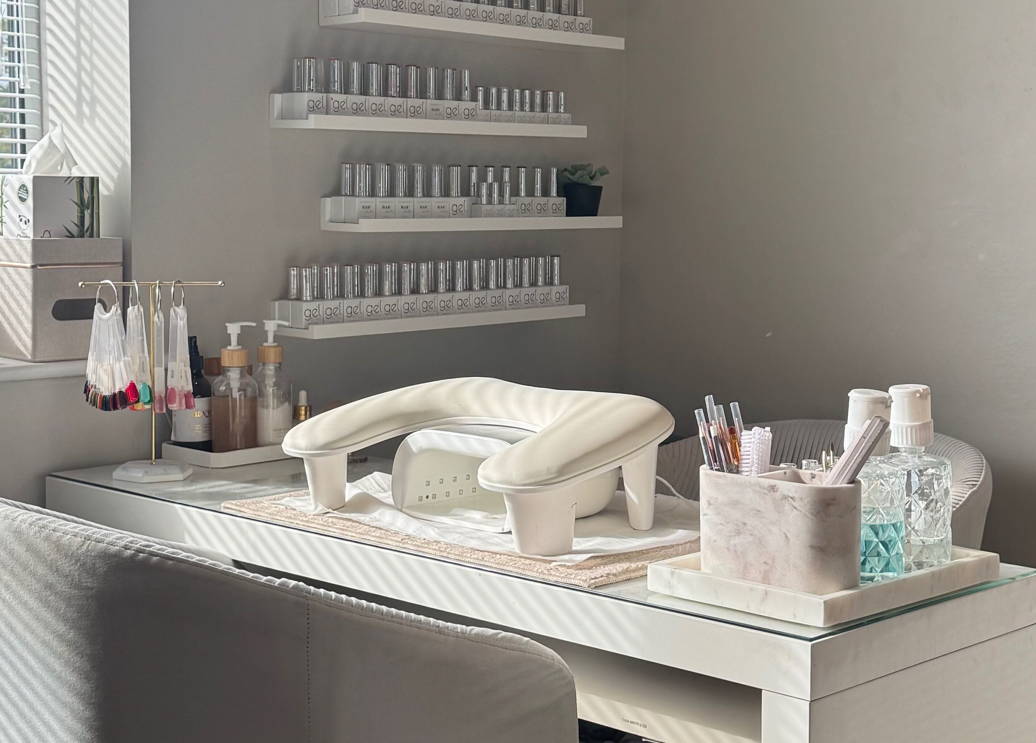 Manicure station at Rachael Ann Aesthetics & Beauty in Harrogate, England, GB, featuring elegant nail polish display.