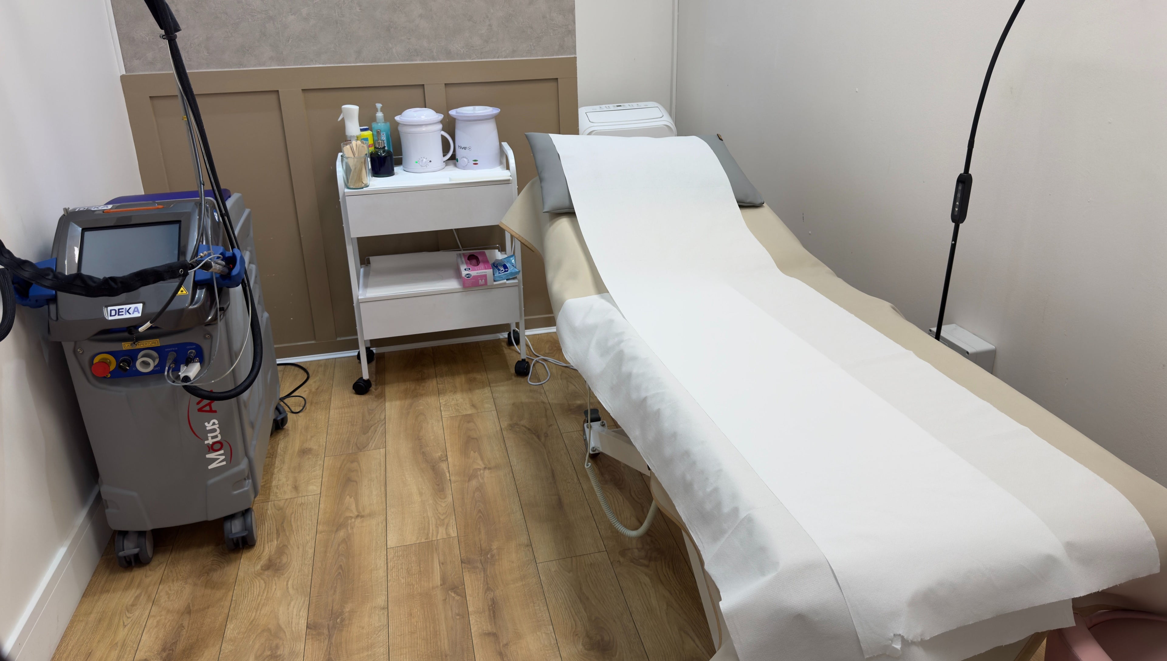 Treatment room at The Elite Wax Group Sheffield - Abbeydale Road, showing equipment and bed in Sheffield, England, GB.