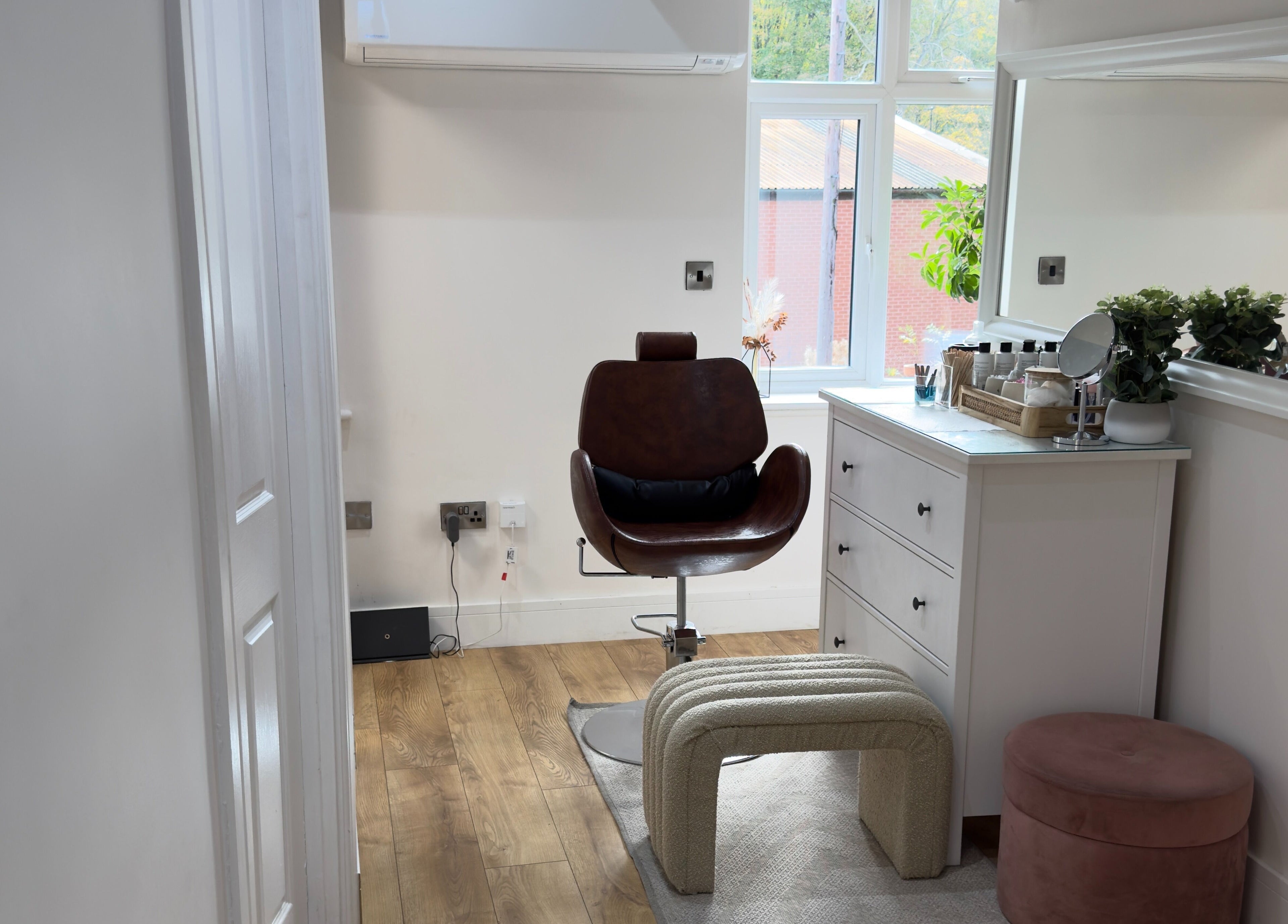 Stylish interior of The Elite Wax Group Sheffield - Abbeydale Road, Sheffield, England, GB, featuring a chair and mirror.