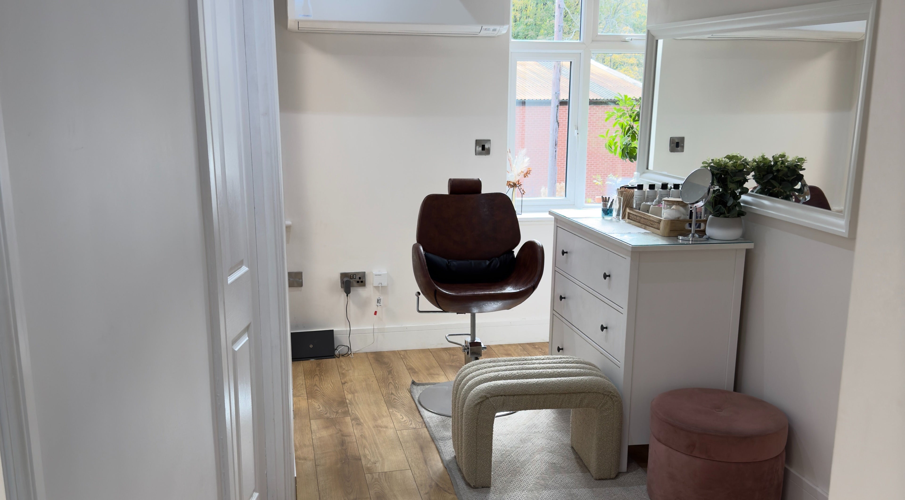 Stylish interior of The Elite Wax Group Sheffield - Abbeydale Road, Sheffield, England, GB, featuring a chair and mirror.