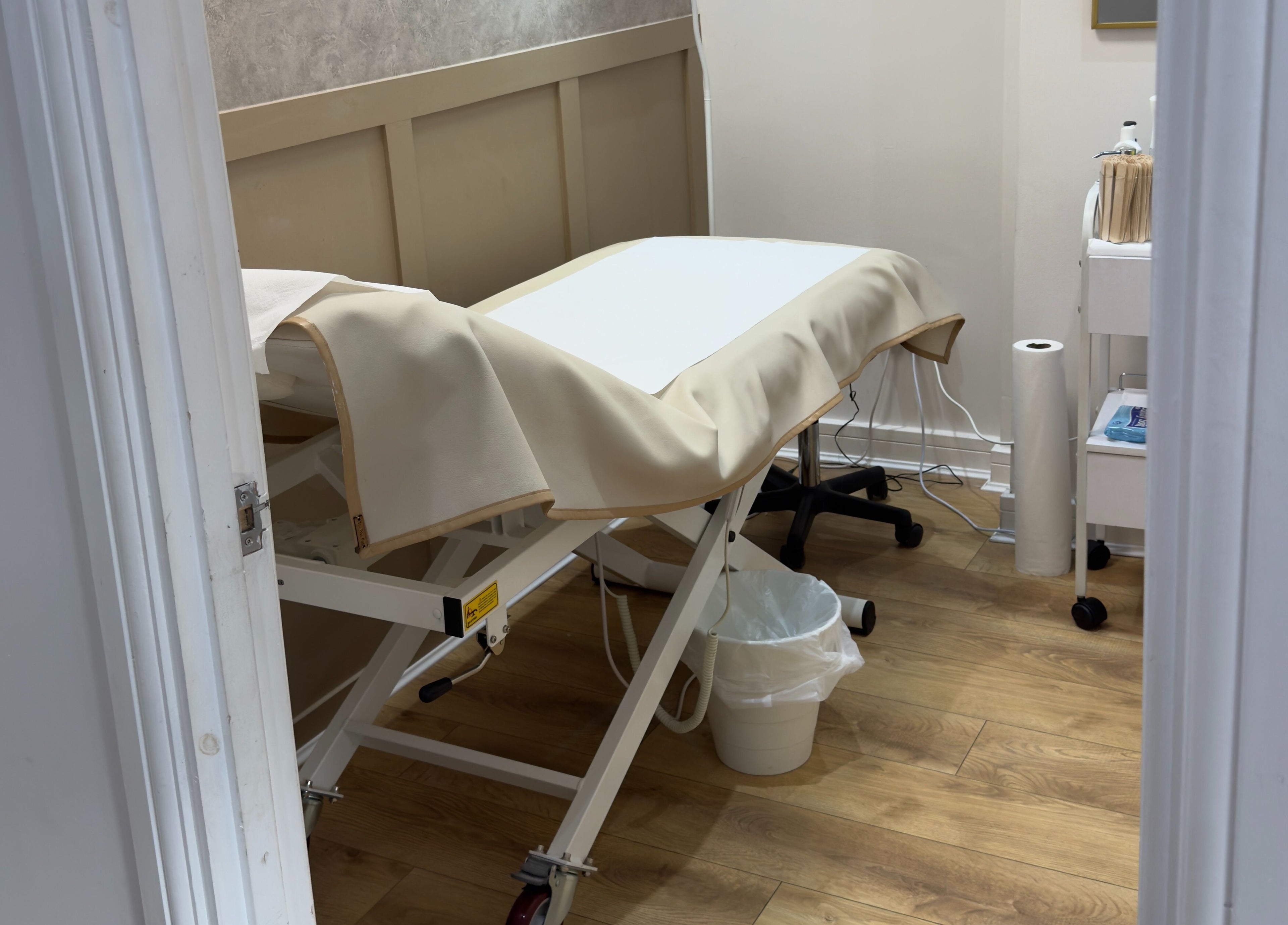 Treatment room at The Elite Wax Group Sheffield - Abbeydale Road, Sheffield, England, GB featuring a massage bed.