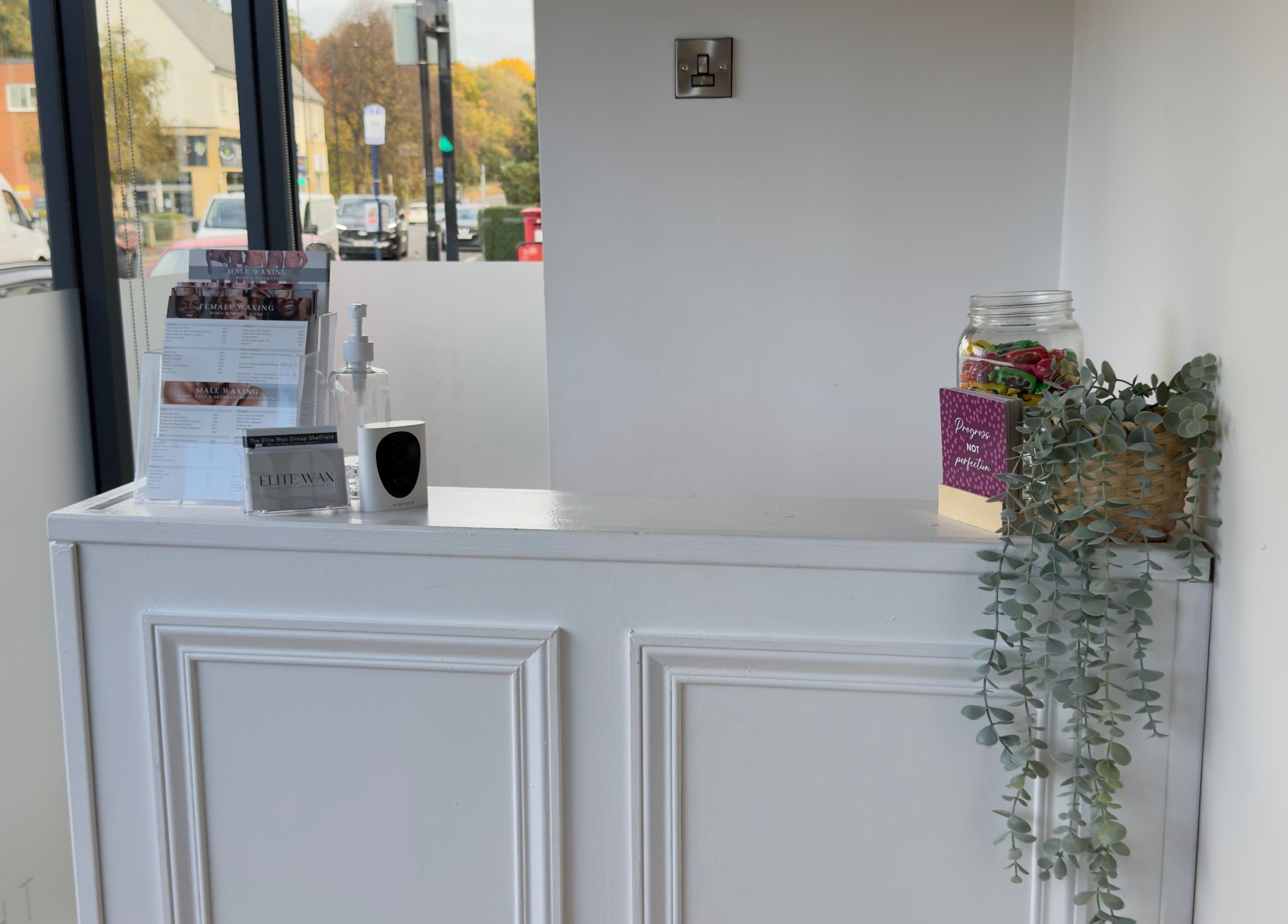 Reception desk at The Elite Wax Group Sheffield - Abbeydale Road with decor, Sheffield, England, GB.