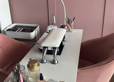 Chic nail station at Beauty By Megs, Irlam, England, GB, featuring pink chairs and manicure tools.
