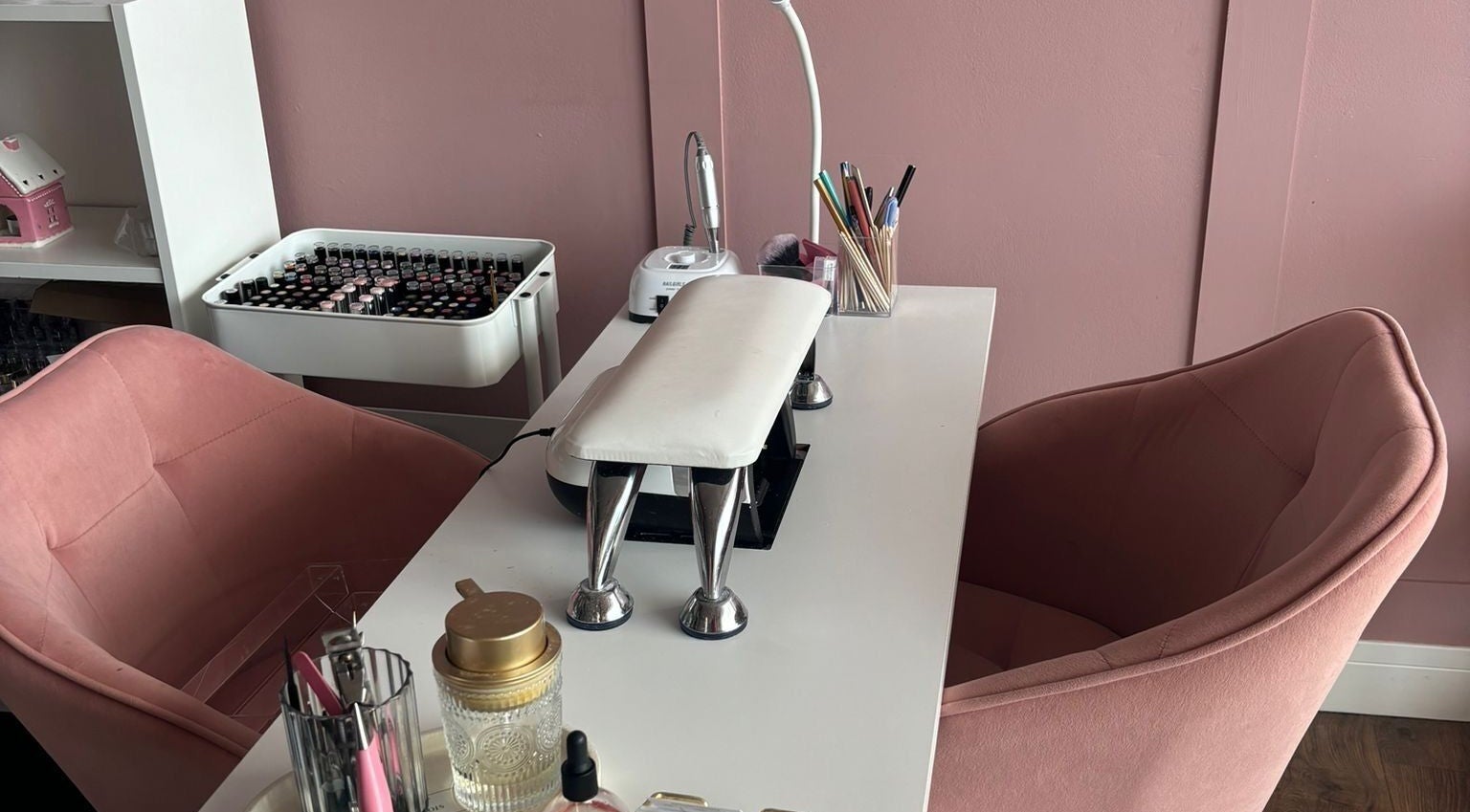 Chic nail station at Beauty By Megs, Irlam, England, GB, featuring pink chairs and manicure tools.
