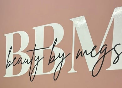 Beauty By Megs sign with elegant script on a pink background in Irlam, England, GB.