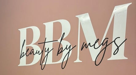 Beauty By Megs sign with elegant script on a pink background in Irlam, England, GB.