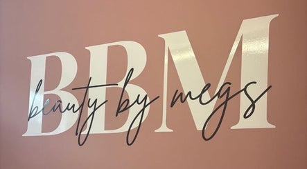 Beauty By Megs logo on a pink wall in Irlam, England, GB.