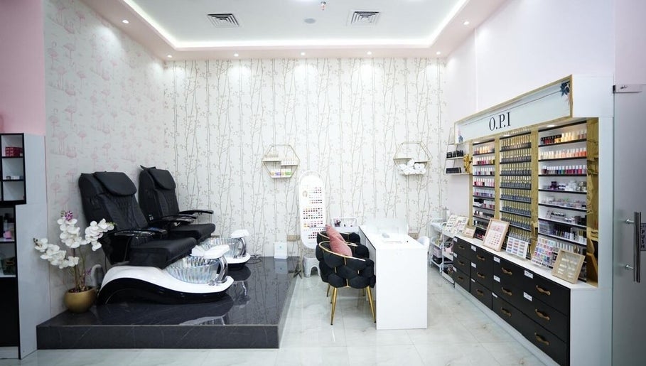 Luxurious nail service area at Dtangle Hair And Beauty Salon, Dubai, Dubai, AE, showcasing modern seating and polishes.