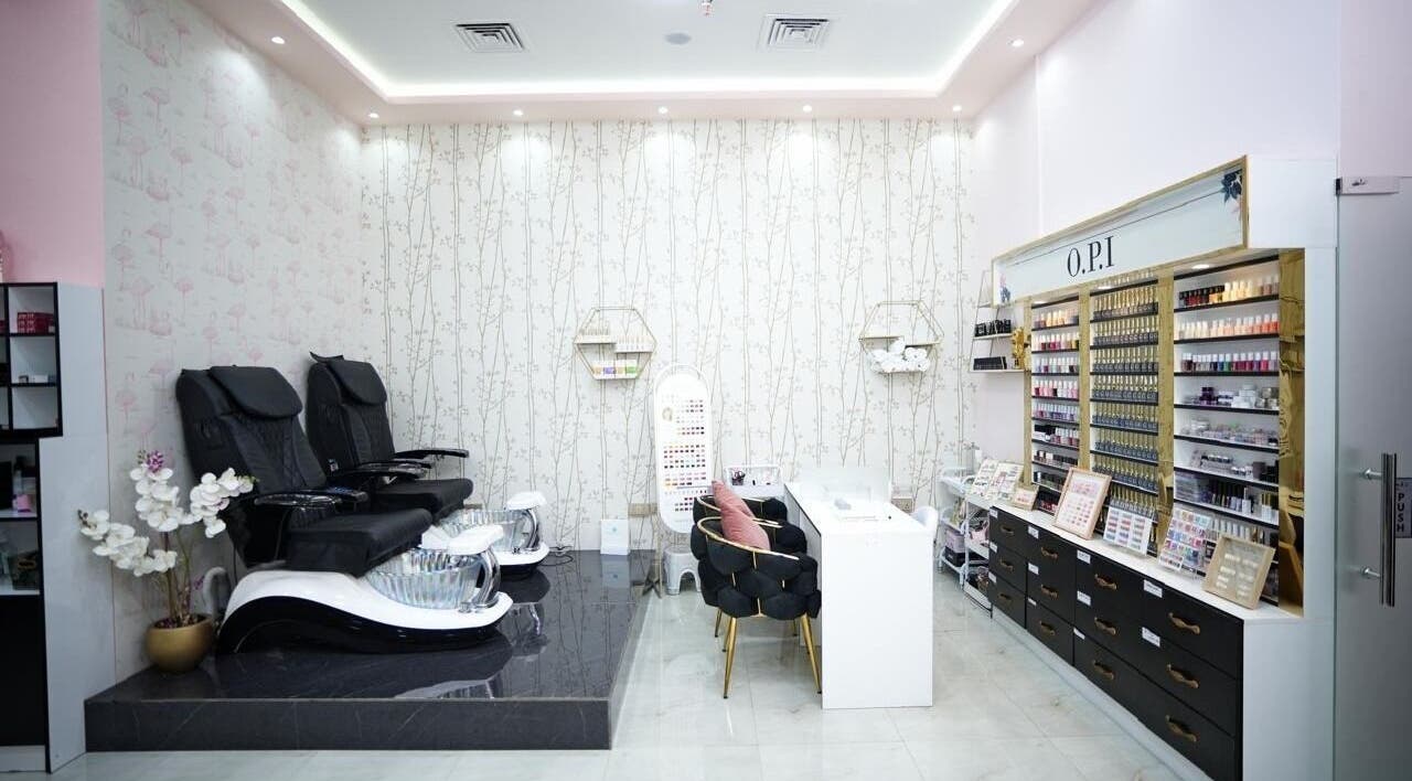 Luxurious nail service area at Dtangle Hair And Beauty Salon, Dubai, Dubai, AE, showcasing modern seating and polishes.