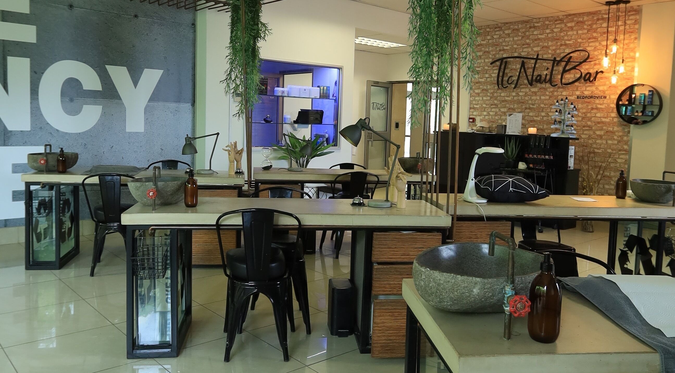 Modern interior of TLC Nail Bar in Germiston, Gauteng, ZA with stylish decor and nail care stations.