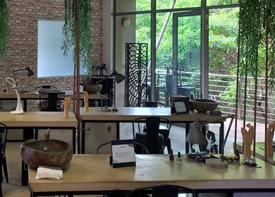 Modern nail salon interior at TLC Nail Bar in Germiston, Gauteng, ZA with sleek workstations and lush greenery.