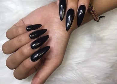 Elegant black stiletto nails manicured at TLC Nail Bar, Germiston, Gauteng, ZA.