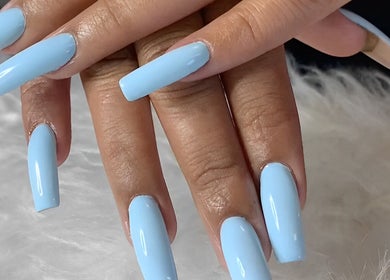 Elegant sky-blue manicure at TLC Nail Bar, Germiston, Gauteng, ZA, showcasing perfect glossy nails.