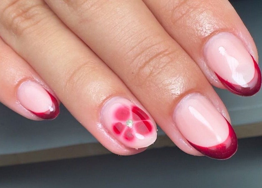 Elegant nail art with crimson tips by By Jay Studio, Wigan, England, GB, showcasing floral design.