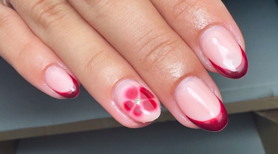 Elegant nail art with crimson tips by By Jay Studio, Wigan, England, GB, showcasing floral design.