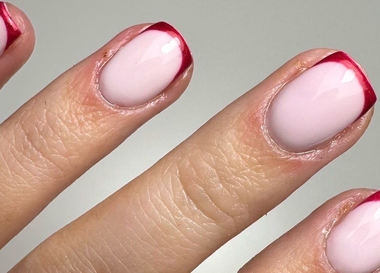 Close-up of pink nails with red tips at By Jay Studio, Wigan, England, GB.
