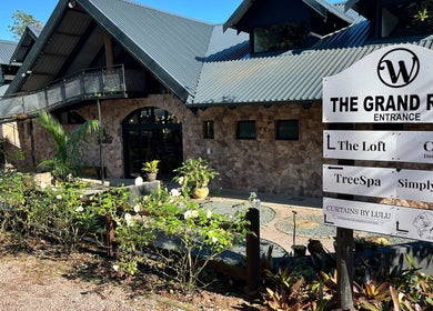 Aruka Studio Aesthetics & Wellness in Outer West Durban, featuring a stone façade and lush greenery.
