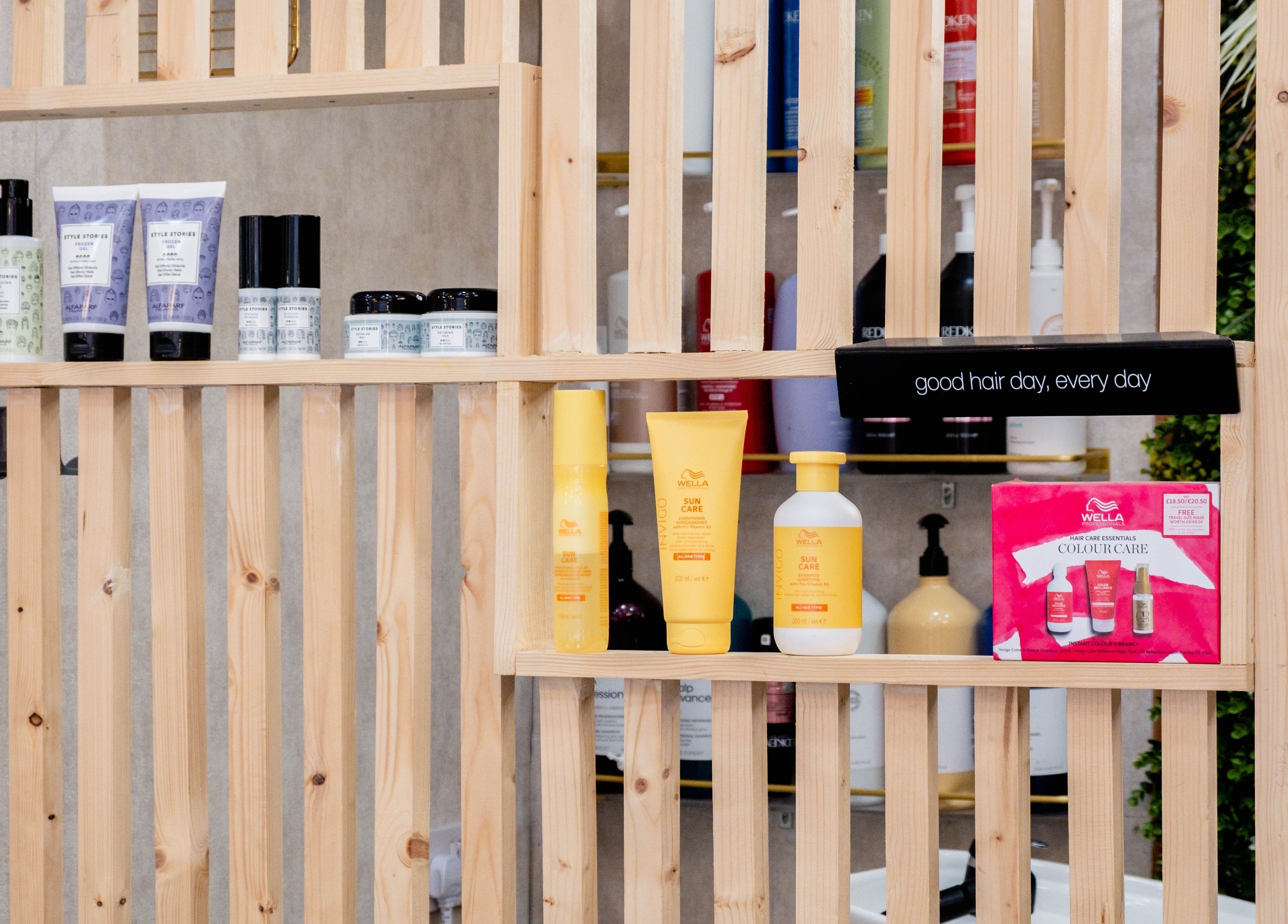 Diverse hair products on a wooden shelf at Arcade Hair Salon in London, England, GB.