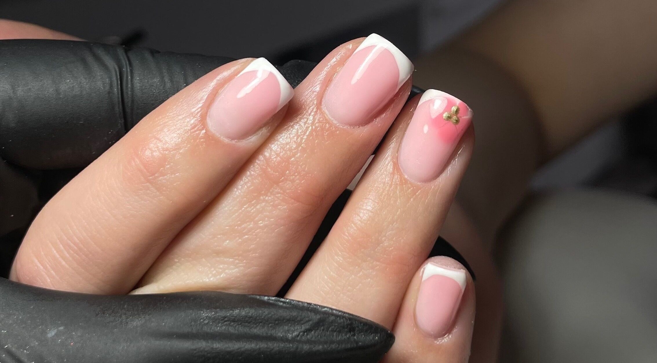 French manicure with floral accent at Beauty by Alx, Liverpool, England, GB.