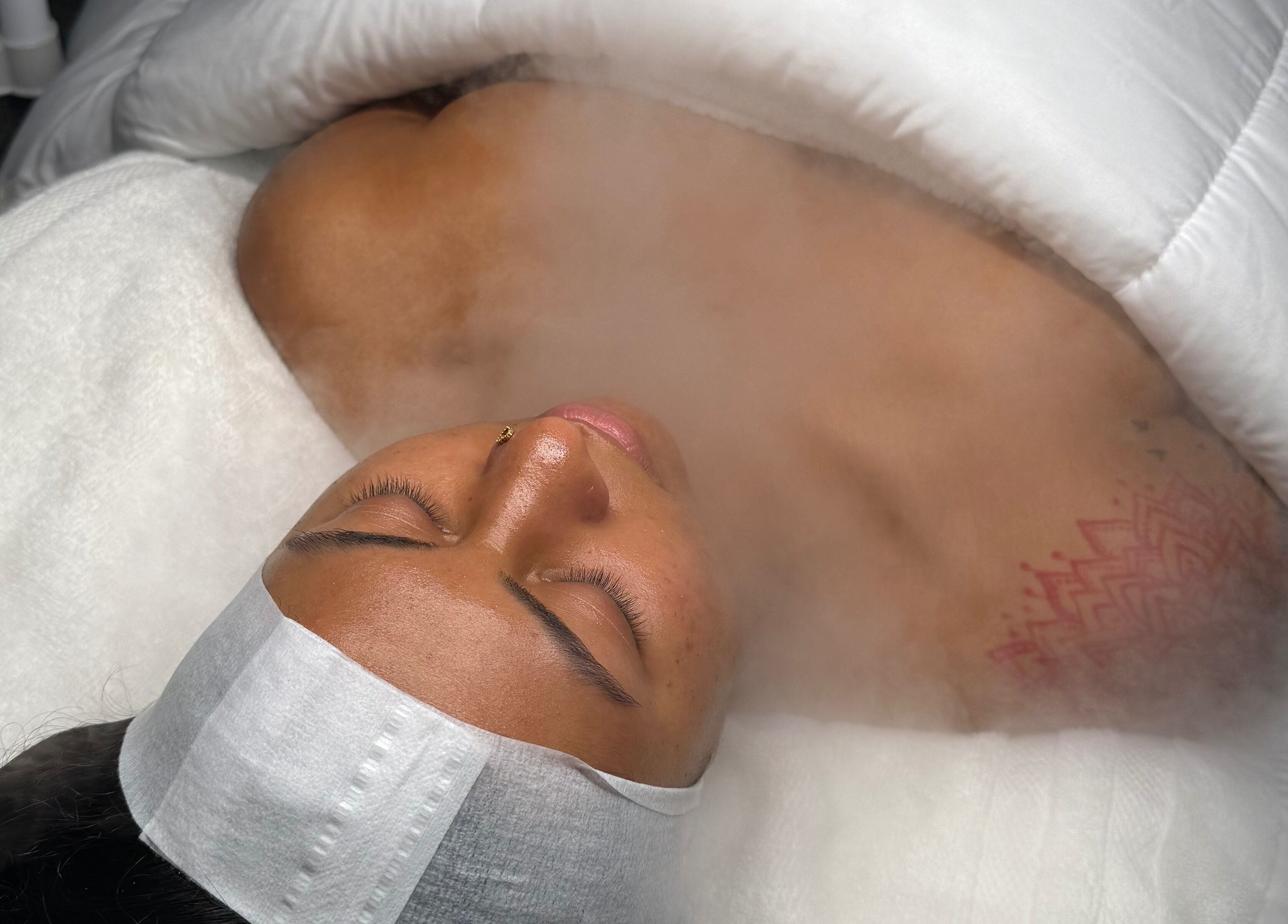 Client enjoying a soothing steam facial at Mina Aesthetics, North Bethesda, Maryland, US.