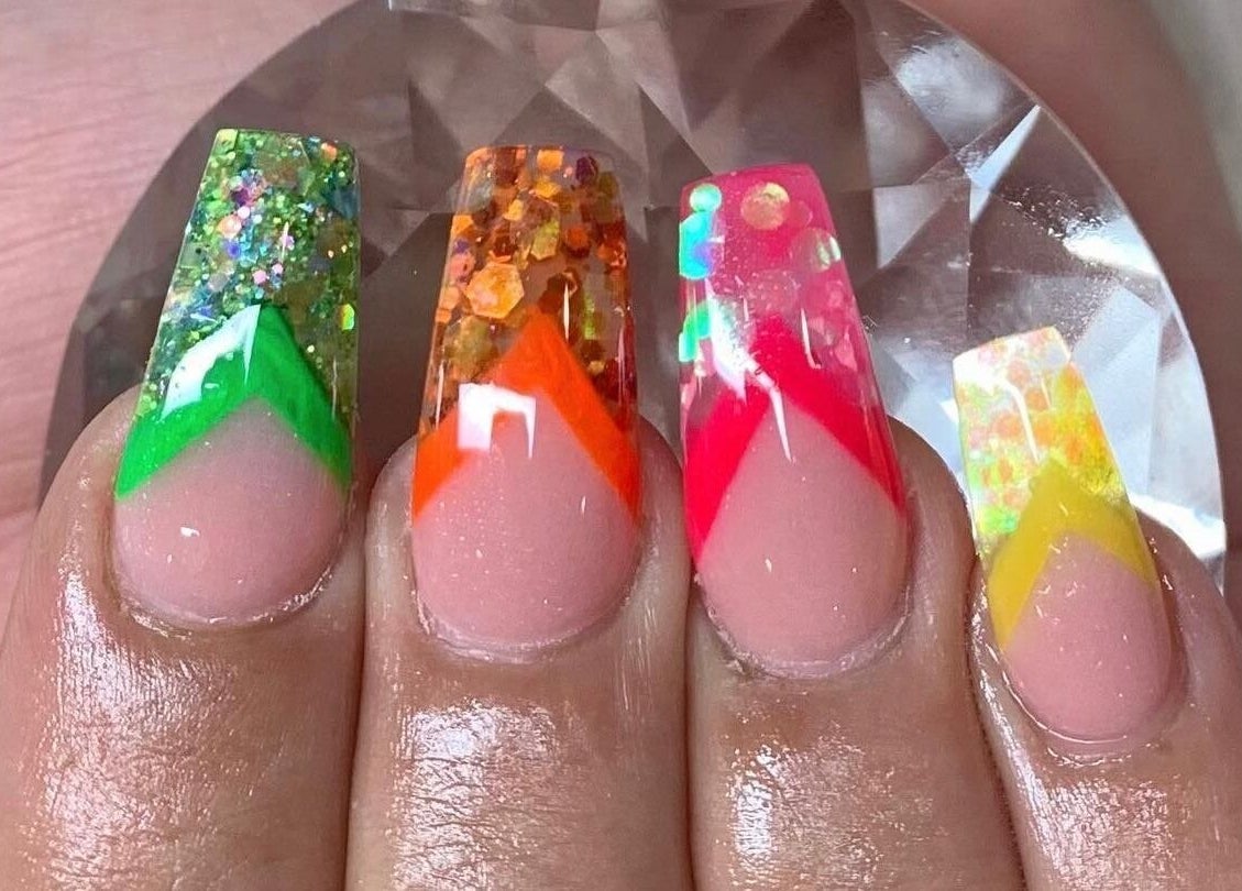 Bright, glittery nail art at SpaLicious Nail Bar, Lancaster, Pennsylvania, US. Explore vibrant designs.