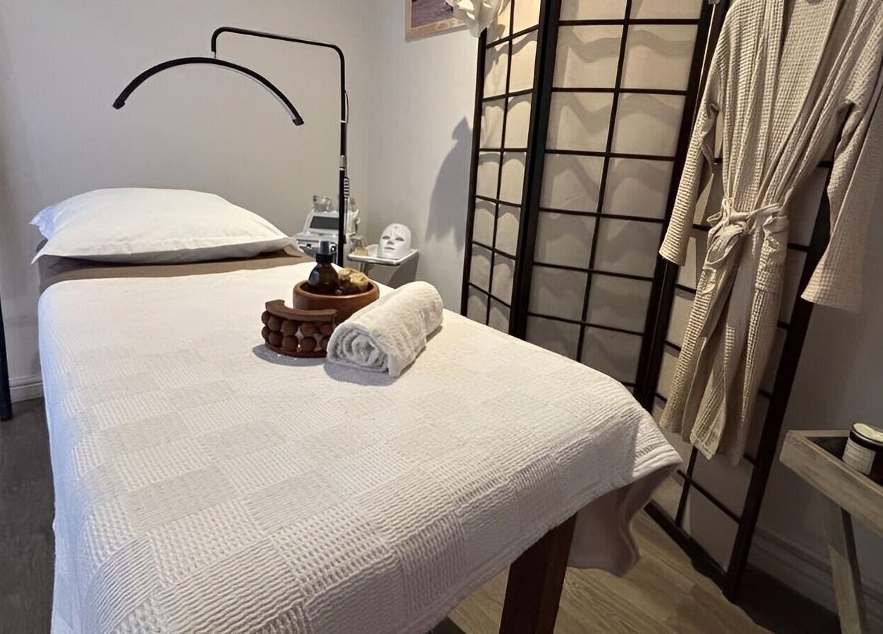 Relaxing massage room at Neem Studio, Cape Town, Western Cape, ZA featuring a cozy treatment bed and calming decor.