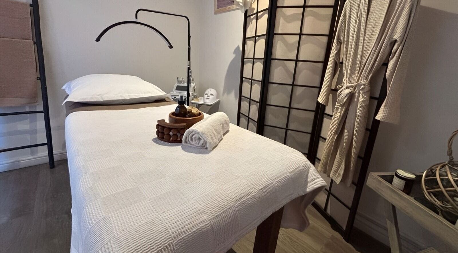 Relaxing massage room at Neem Studio, Cape Town, Western Cape, ZA featuring a cozy treatment bed and calming decor.
