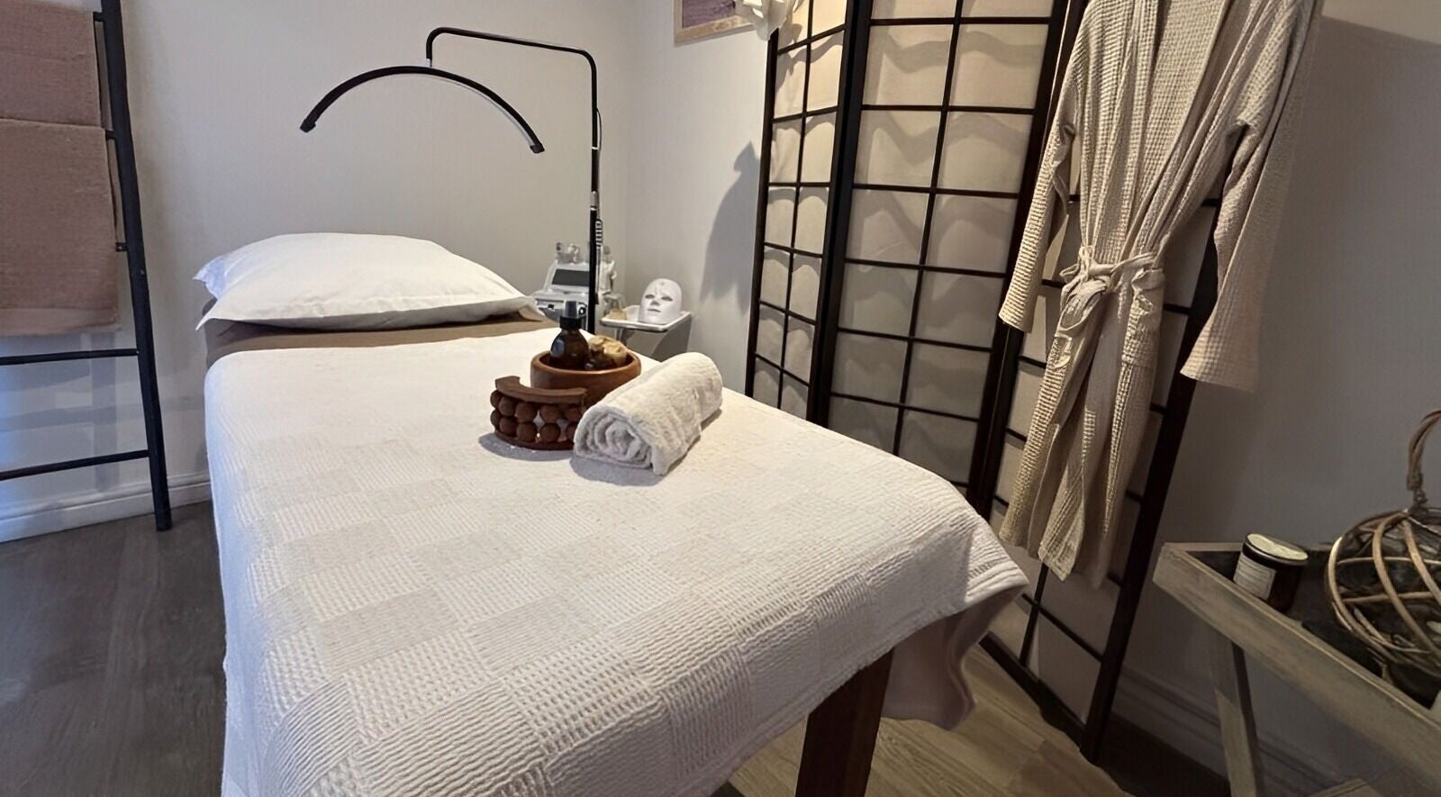 Relaxing massage room at Neem Studio, Cape Town, Western Cape, ZA featuring a cozy treatment bed and calming decor.