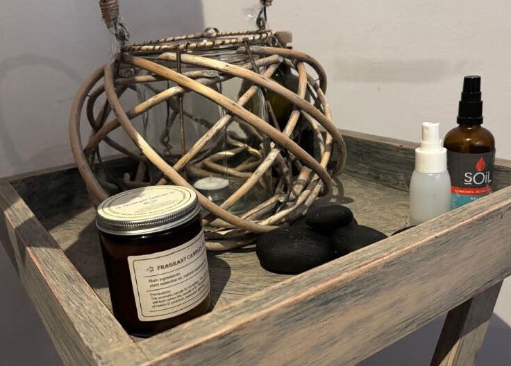 Spa essentials displayed at Neem Studio, Cape Town, Western Cape, ZA. Featuring candles and oils.