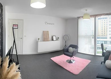 Elegant beauty room at Dionoire, Milton Keynes, England, GB. Features modern decor with natural light and seating.