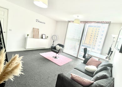 Bright and modern salon area at Dionoire, MILTON KEYNES, England, GB with stylish decor and comfortable seating.