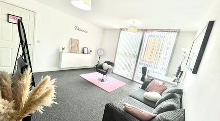 Bright and modern salon area at Dionoire, MILTON KEYNES, England, GB with stylish decor and comfortable seating.