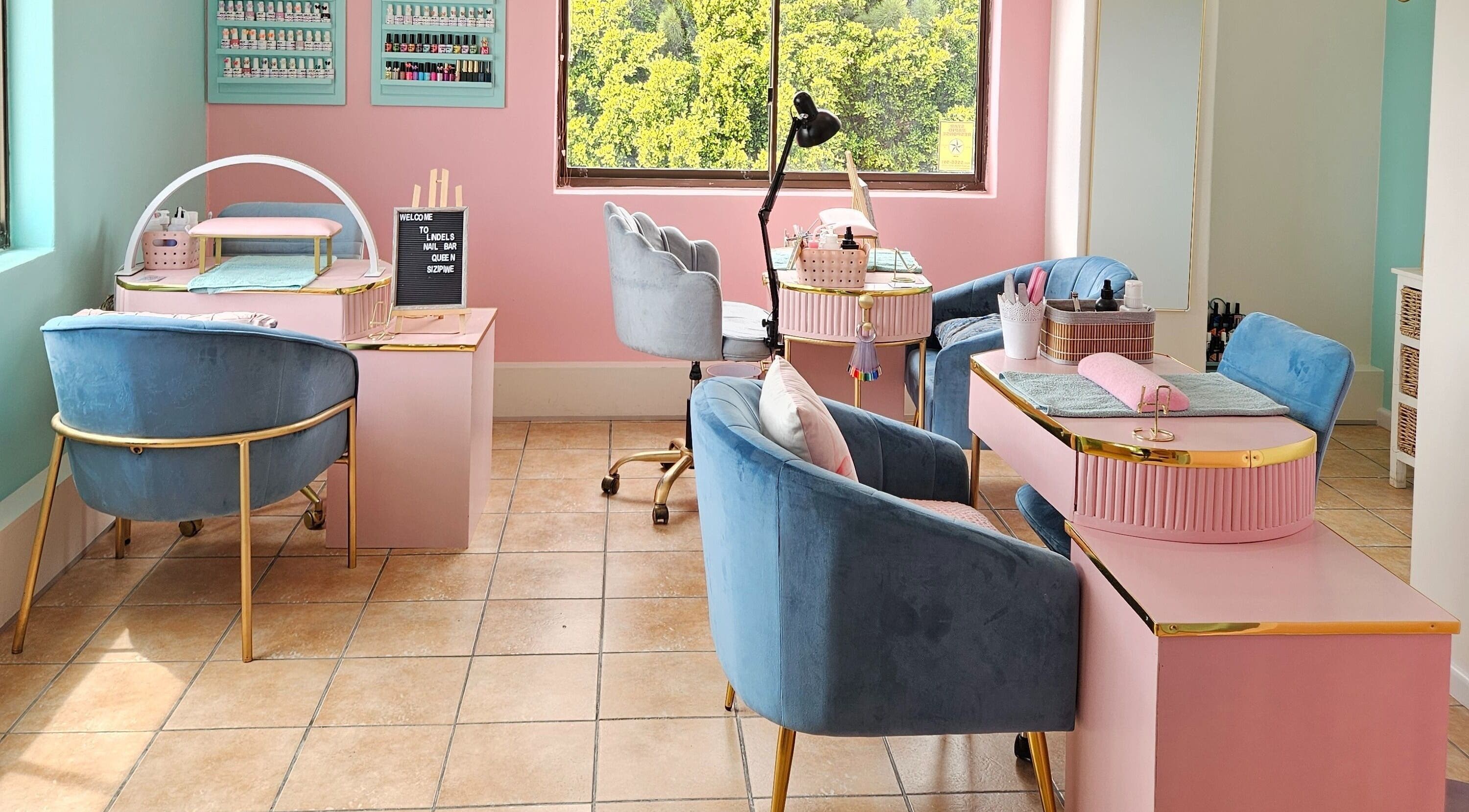 Stylish interior of Lindels Nail Bar in Cape Town, Western Cape, ZA with pink and blue decor.