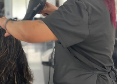 Stylist blow-drying hair at Time to Shine Hair Salon, Toi Ohomai - Mokoia, Rotorua, Bay of Plenty, NZ.