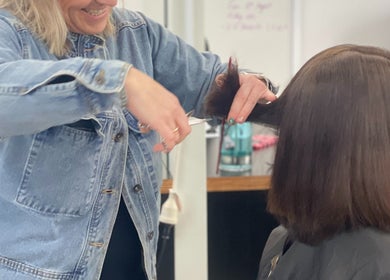 Hairdresser trims hair at Time to Shine Hair Salon, Toi Ohomai - Mokoia, Rotorua, Bay of Plenty, NZ.