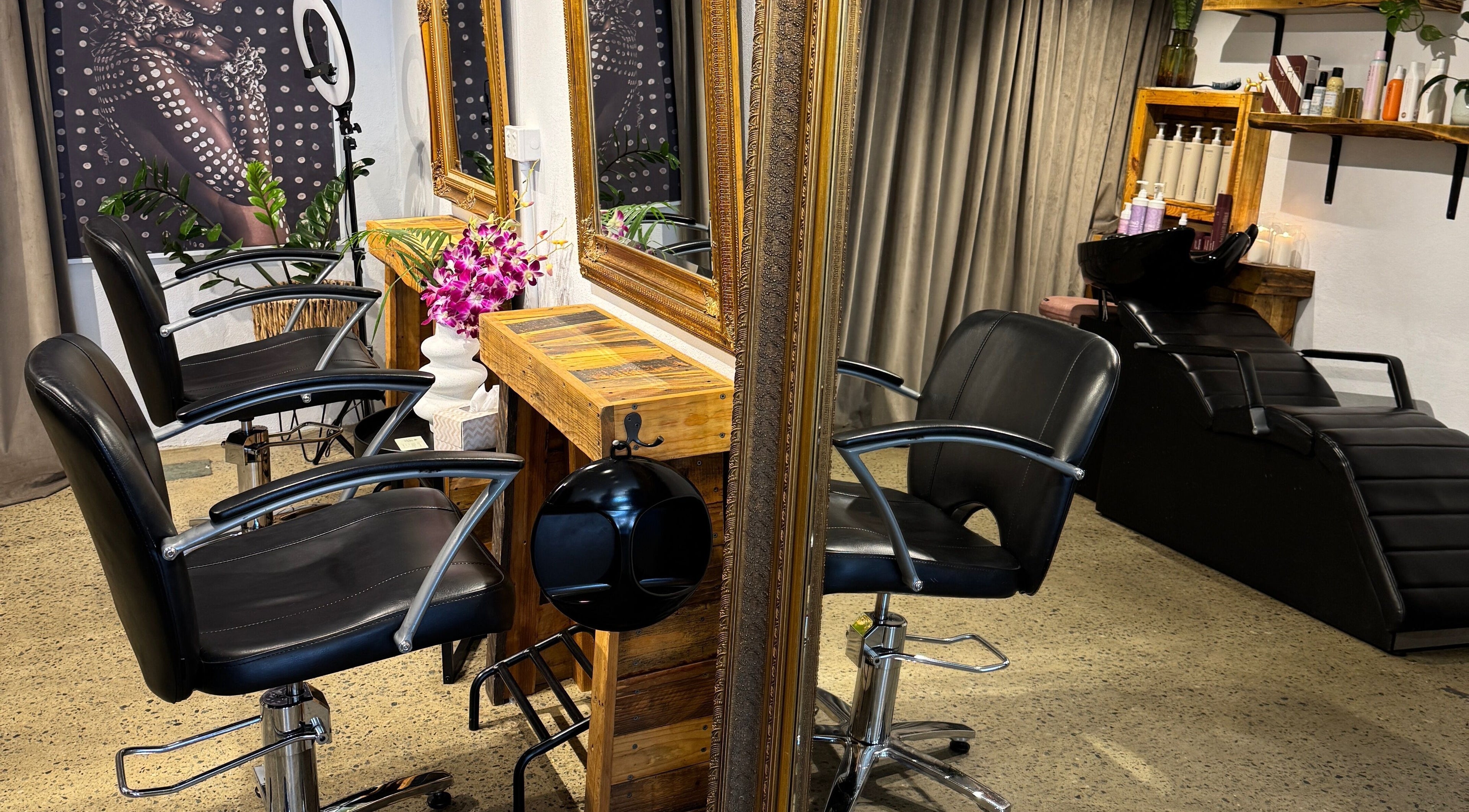 Modern salon chairs and mirrors at Claire Louise Hair, South Fremantle, Western Australia, AU.