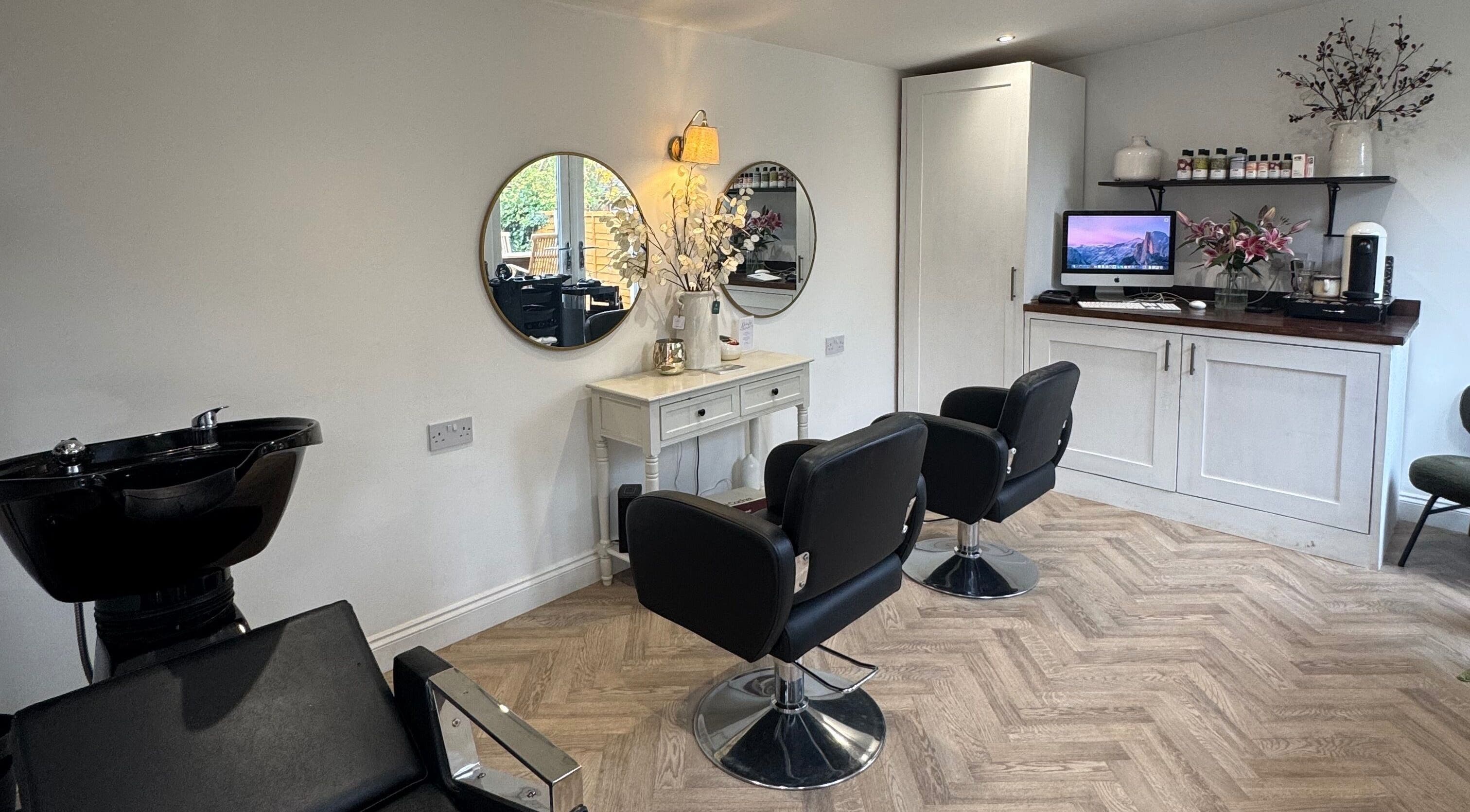 Interior of Jenna Louise Hair in Chelford, England, GB featuring styling chairs and mirrors.