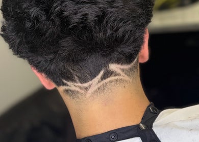 Stylish undercut hairstyle at Barber Jake, Motueka, Tasman, NZ. Showcase of intricate hair design.