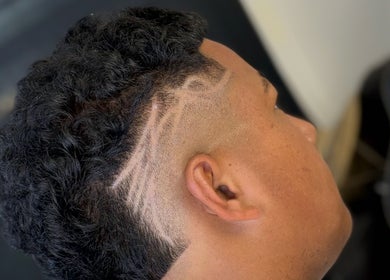 Intricate haircut design by Barber Jake at Motueka, Tasman, NZ showcasing detailed artistic fade.