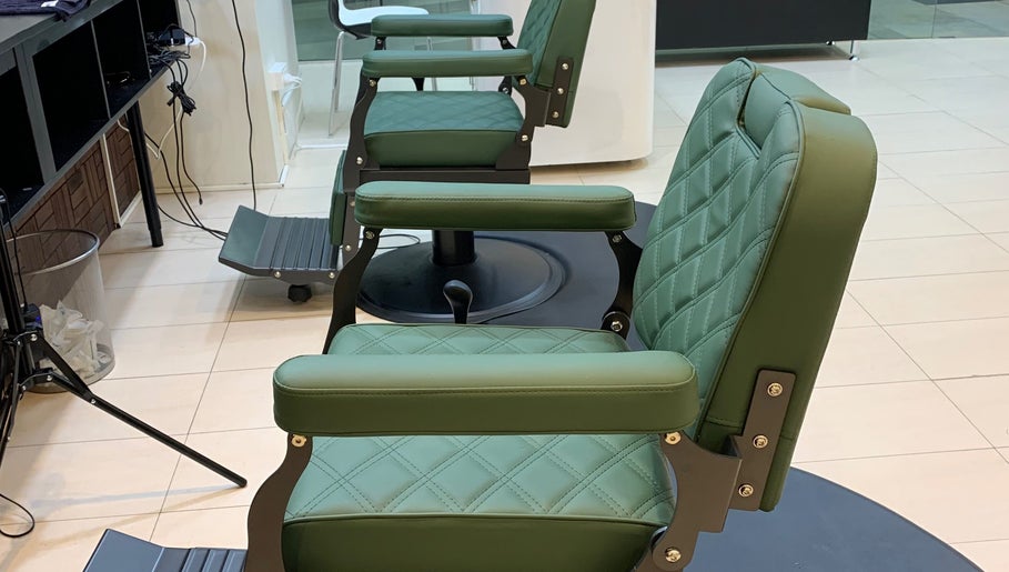 Green leather barber chairs at Men’s Portal Barbershop, Perth, Western Australia, AU.